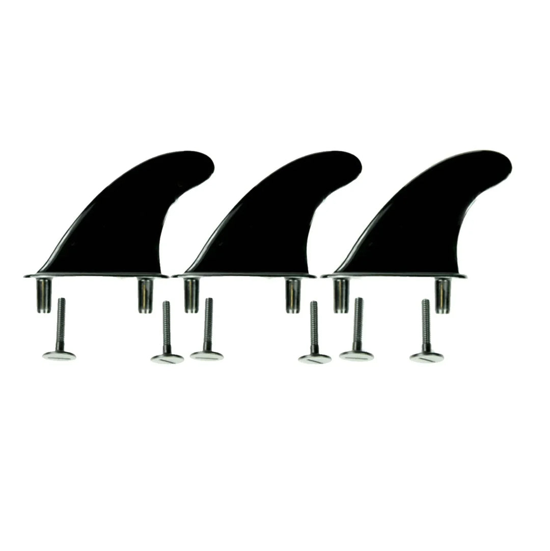 Three black replacement softboard fins on a white background